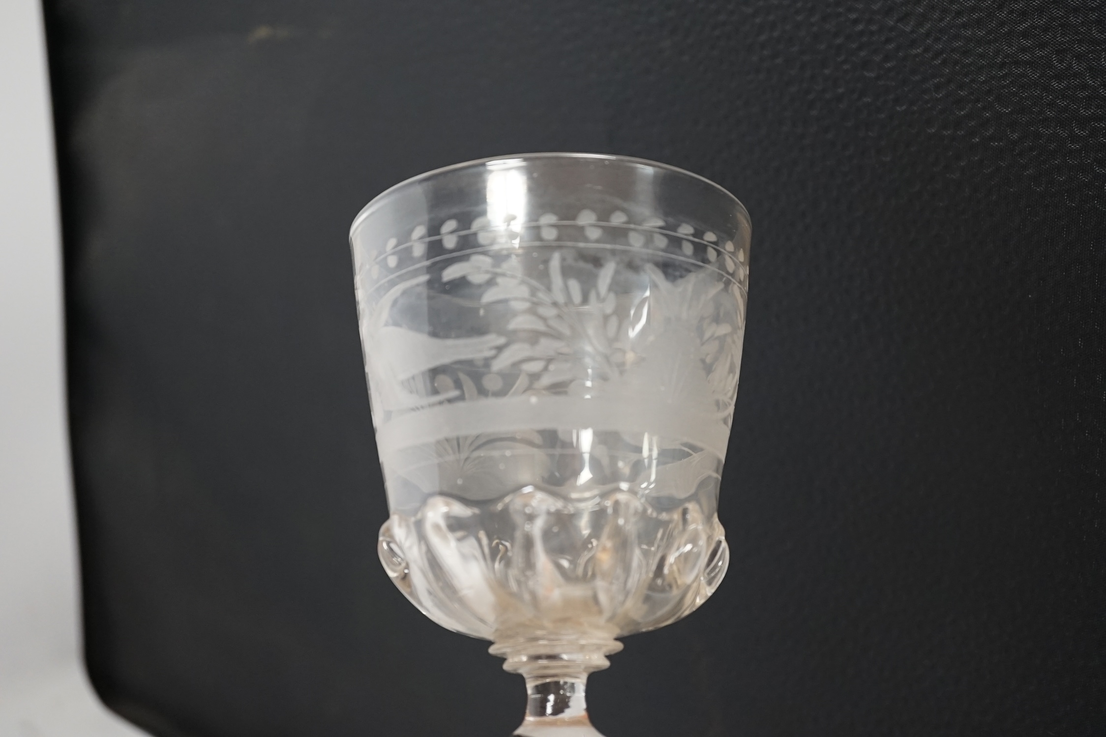A Dutch or Bohemian glass goblet with engraved bowl, in late 17th century style, 23cm high. Condition - good